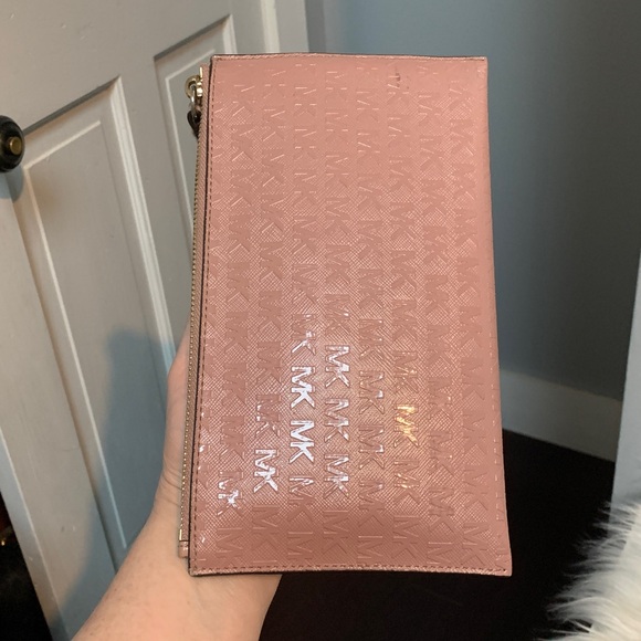 Authentic soft pink patent leather large wristlet clutch by Michael Kors